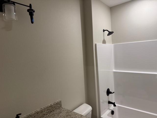 309 Garland Street Bells, TX 75414 - Photo 15 of 16 a bathroom with a shower and toilet