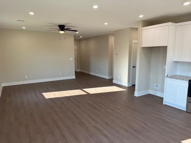 309 Garland Street Bells, TX 75414 - Photo 5 of 16 an empty room with wooden floor and entrance to ceiling window
