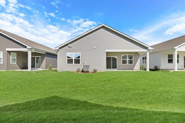 a bathroom with a sink a toilet a tub and shower