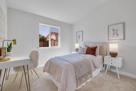 a bedroom with bed and a window