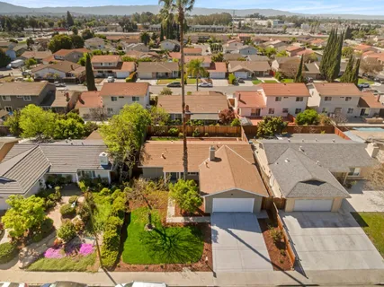 an aerial view of residential houses with outdoor space