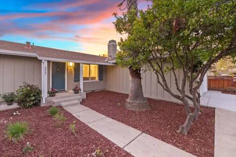 a front view of a house with garden