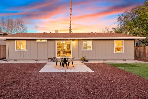 a view of a backyard with a patio