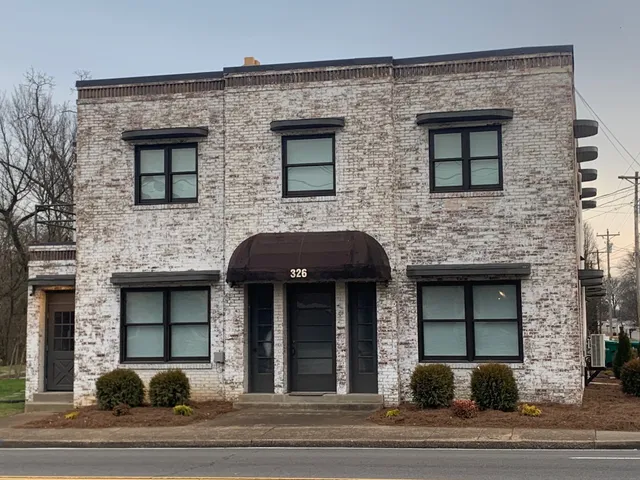 a front view of a house with street