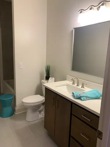a kitchen with stainless steel appliances a refrigerator and a stove top oven