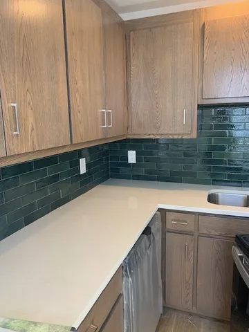 a bathroom with a toilet and a bath tub