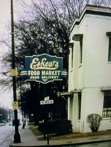 a large kitchen with a large counter top stainless steel appliances and cabinets