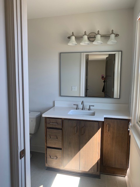 326 West Main Street Lebanon, TN 37087 - Photo 36 of 63 a bathroom with a double vanity sink and mirror
