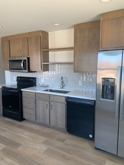 326 West Main Street Lebanon, TN 37087 - Photo 56 of 63 a kitchen with a sink stove and cabinets