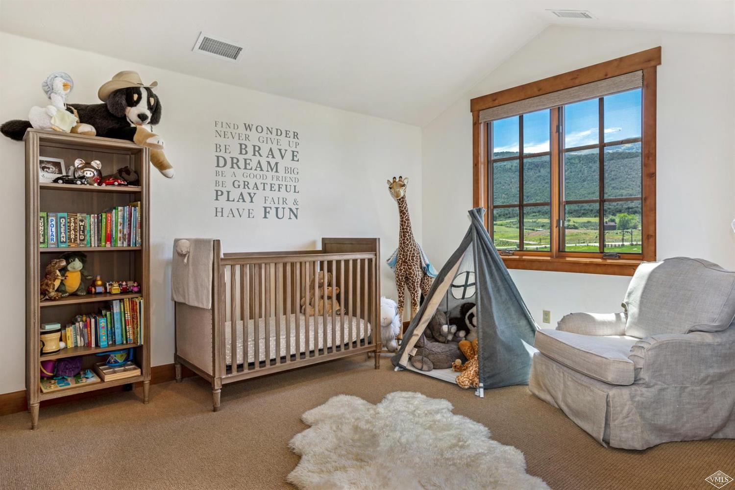 74 Lasso Gypsum, CO 81637 - Photo 20 of 25 a view of a bedroom with baby crib and a window