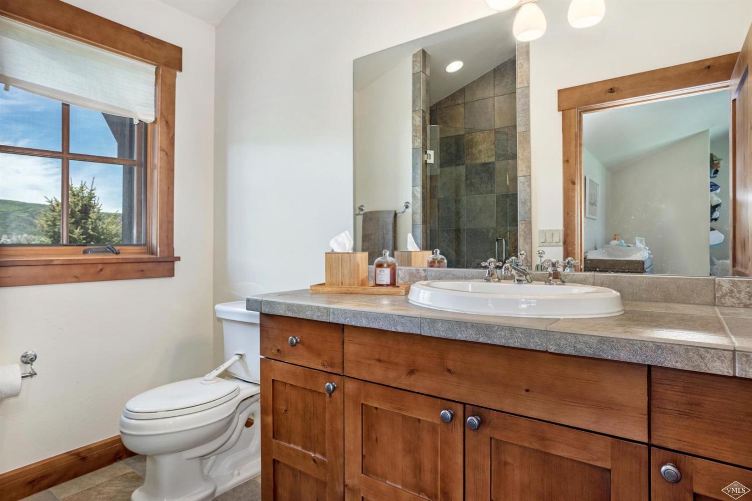 74 Lasso Gypsum, CO 81637 - Photo 21 of 25 a bathroom with a sink toilet and mirror