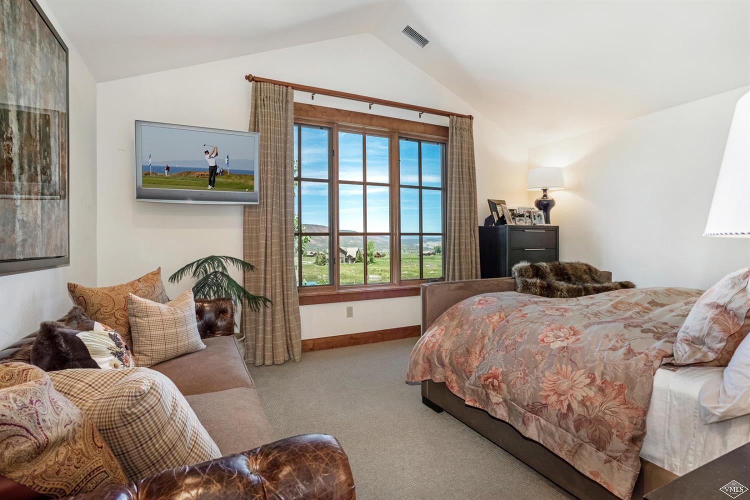 74 Lasso Gypsum, CO 81637 - Photo 24 of 25 a bedroom with a bed and a window