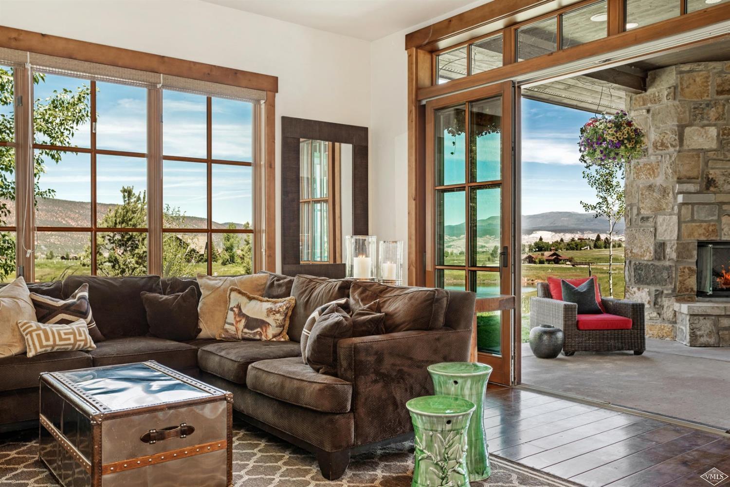 74 Lasso Gypsum, CO 81637 - Photo 7 of 25 a living room with furniture and a floor to ceiling window