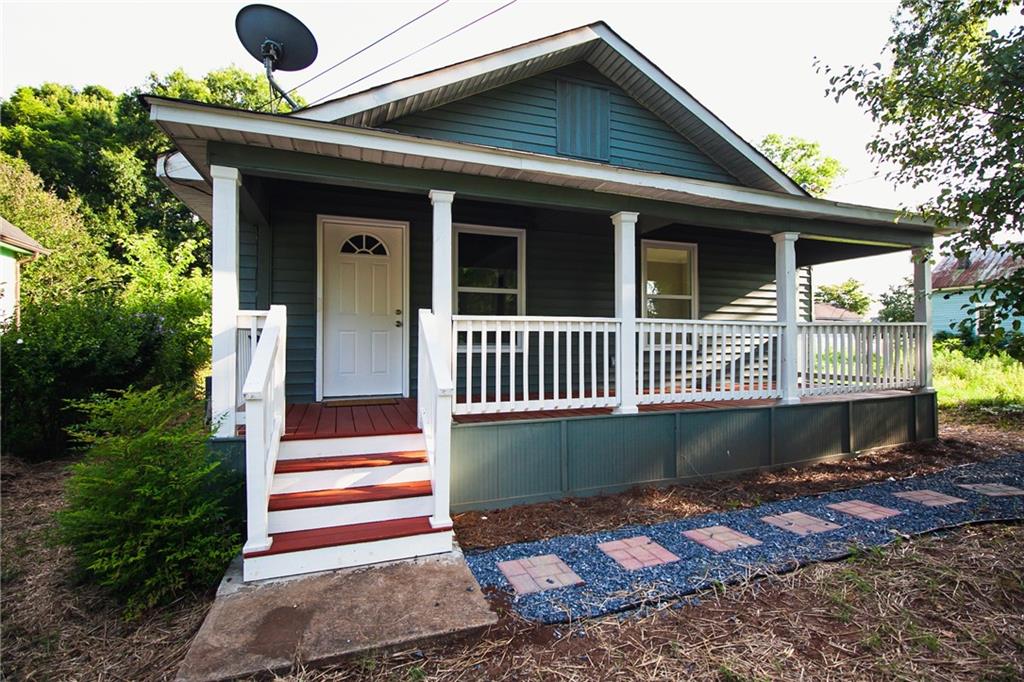 204 East 14th Street Rome, GA 30161 - Photo 1 of 1 a front view of a house with garden