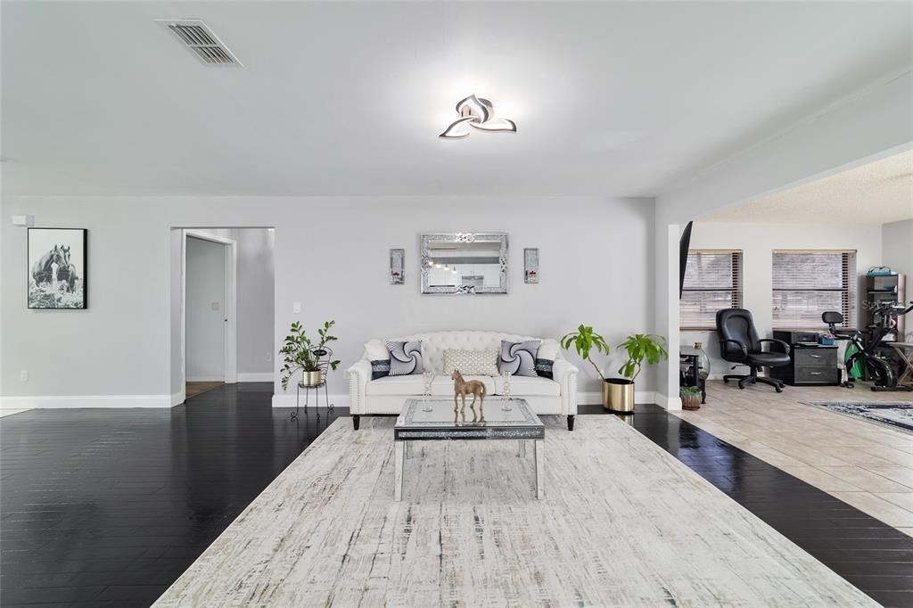 985 Northwest 73rd Terrace Ocala, FL 34482 - Photo 42 of 89 a living room with furniture wooden floor and window