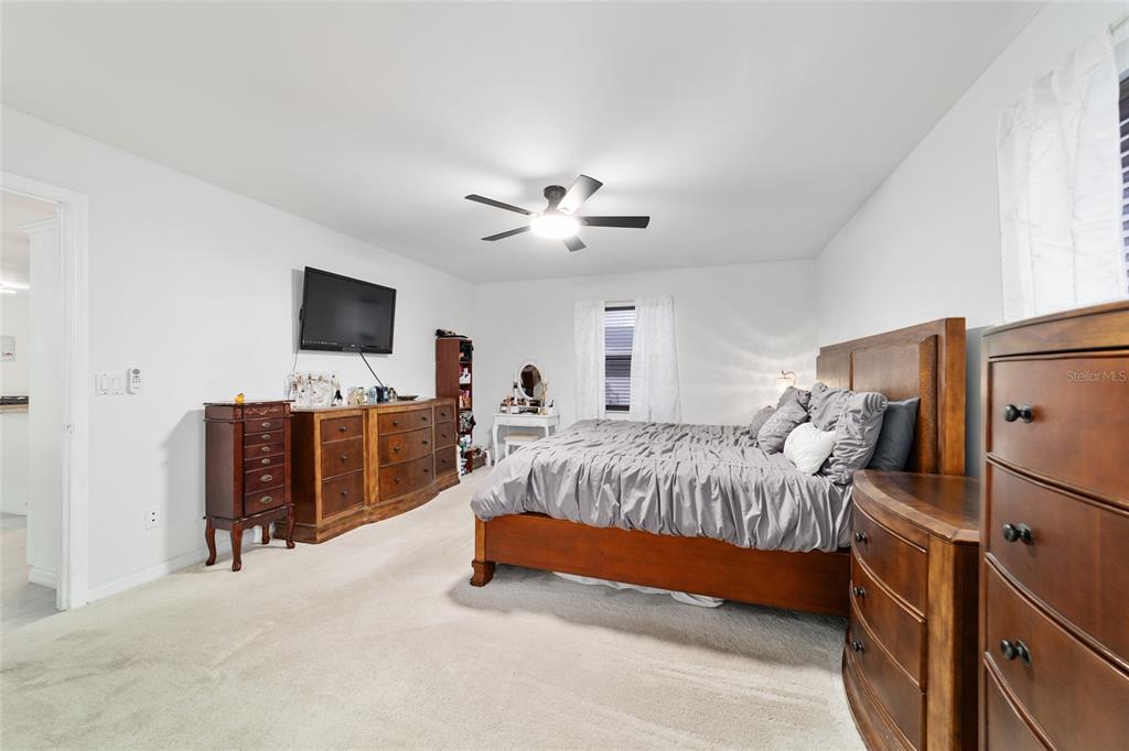 985 Northwest 73rd Terrace Ocala, FL 34482 - Photo 45 of 89 a bedroom with bed tv and flat screen tv