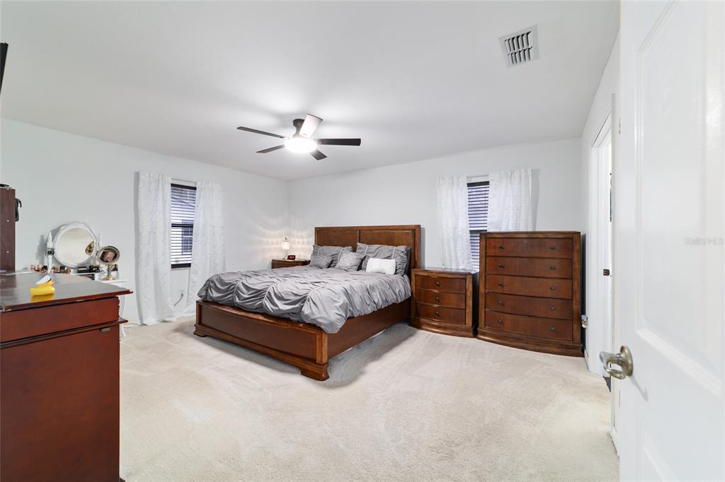 985 Northwest 73rd Terrace Ocala, FL 34482 - Photo 48 of 89 a bedroom with a bed and dresser