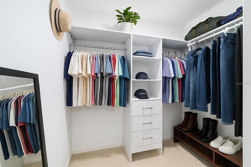985 Northwest 73rd Terrace Ocala, FL 34482 - Photo 49 of 89 a view of walk in closet with clothes and shoes