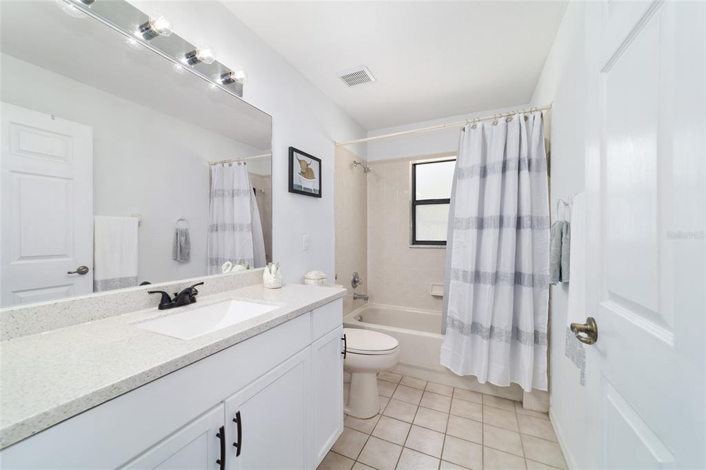 985 Northwest 73rd Terrace Ocala, FL 34482 - Photo 55 of 89 a bathroom with a sink a toilet and shower