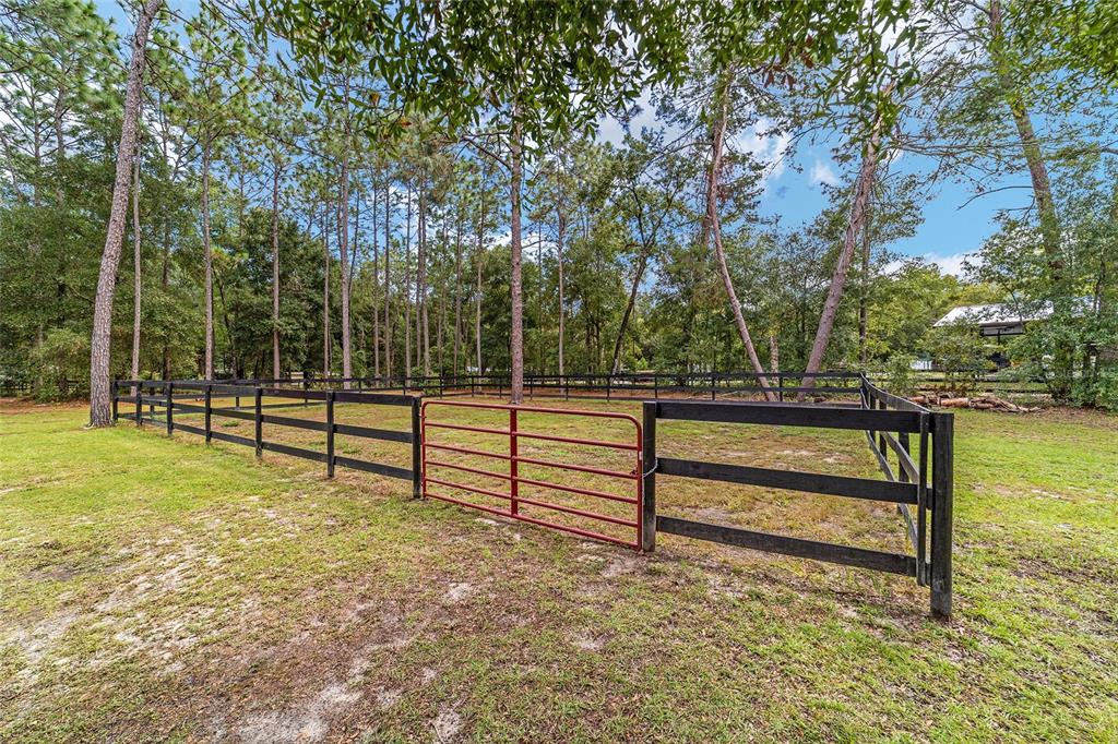 985 Northwest 73rd Terrace Ocala, FL 34482 - Photo 62 of 89 a view of park with wooden fence