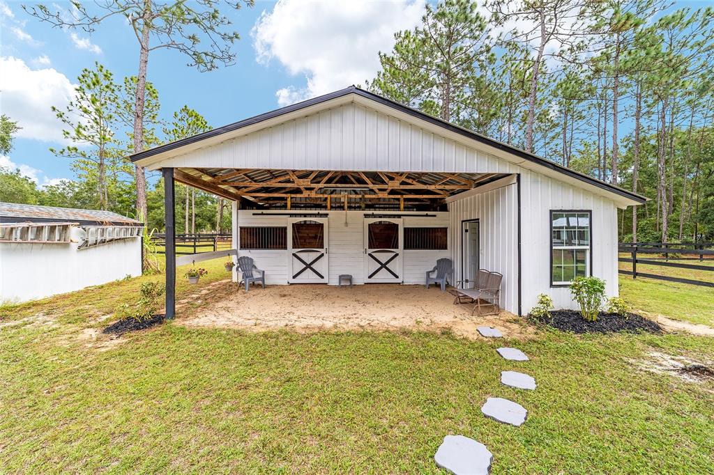 985 Northwest 73rd Terrace Ocala, FL 34482 - Photo 68 of 89 a view of a house with backyard and trees