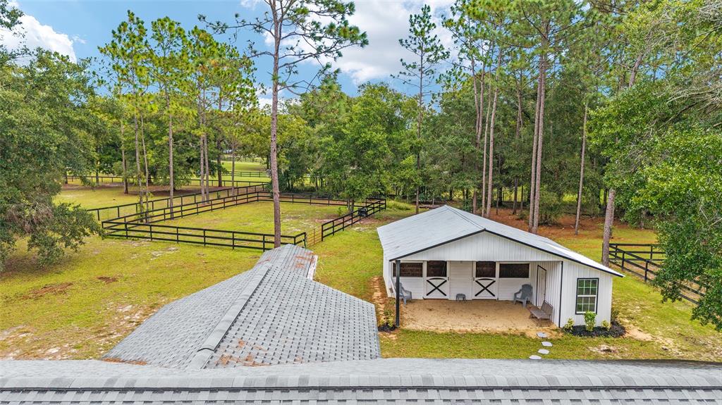 985 Northwest 73rd Terrace Ocala, FL 34482 - Photo 88 of 89 a view of a house with a yard