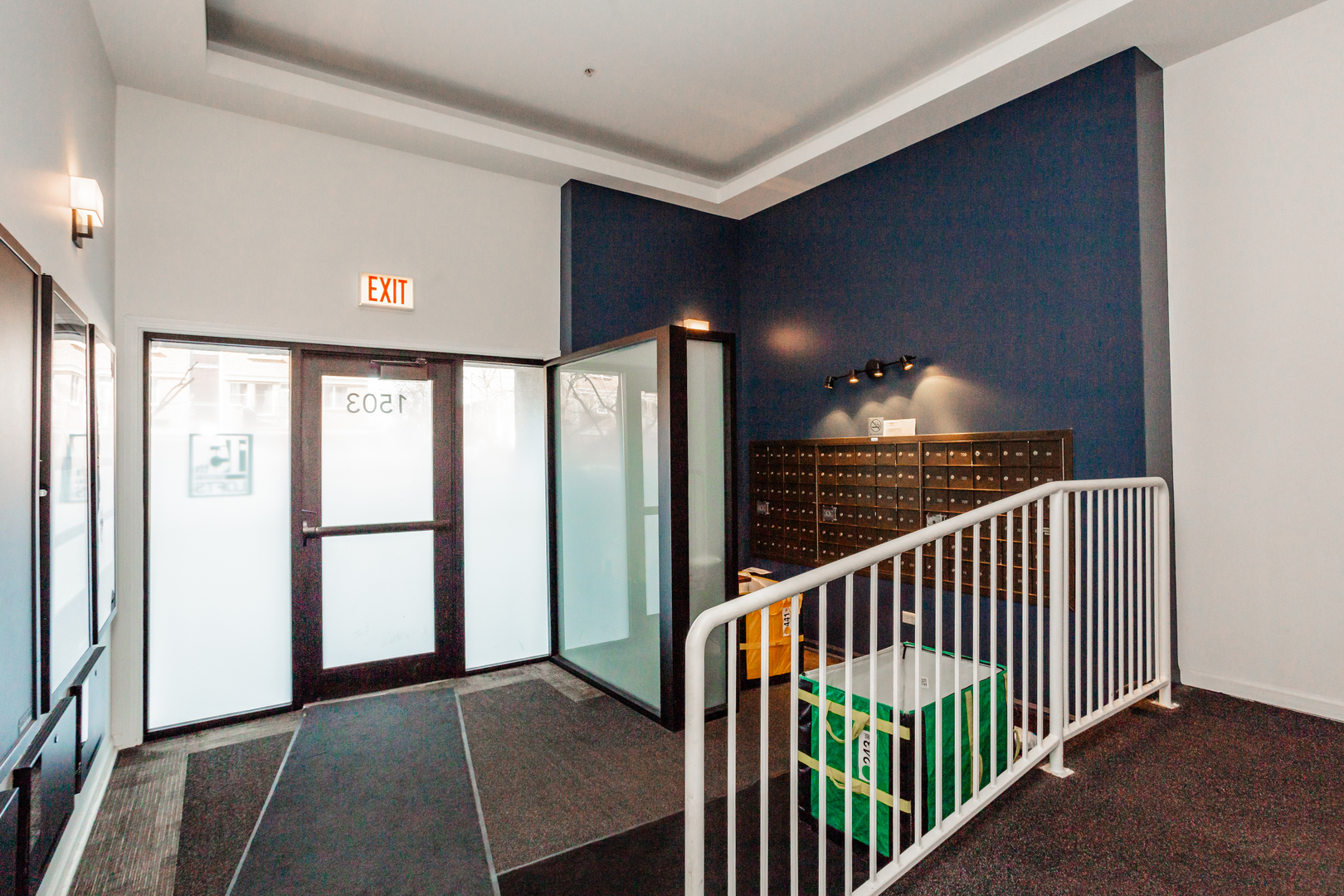 1503 South State Street, Unit 810 Chicago, IL 60605 - Photo 3 of 16 a view of staircase with railing and a chandelier