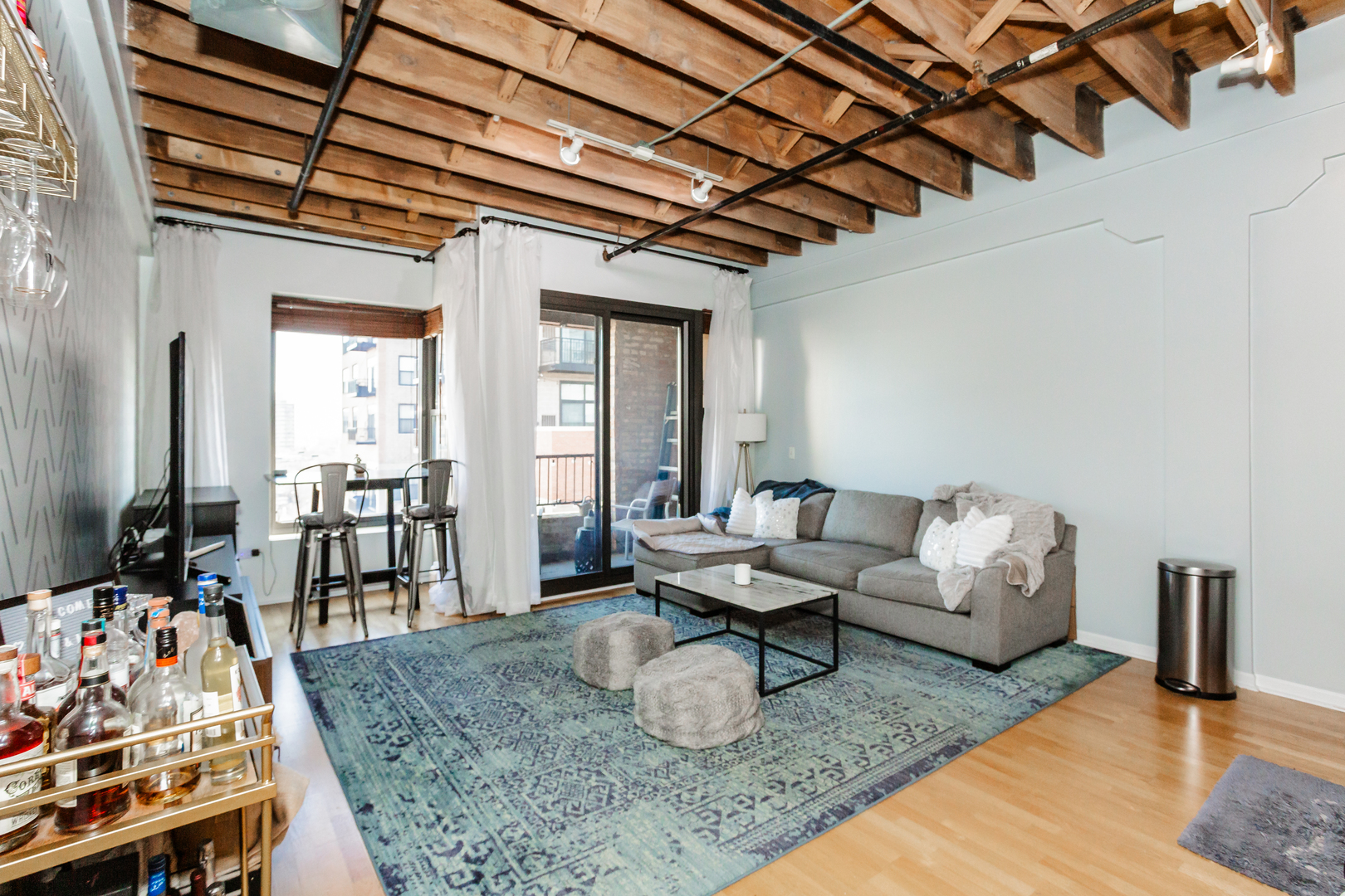 1503 South State Street, Unit 810 Chicago, IL 60605 - Photo 4 of 16 a living room with furniture and a flat screen tv