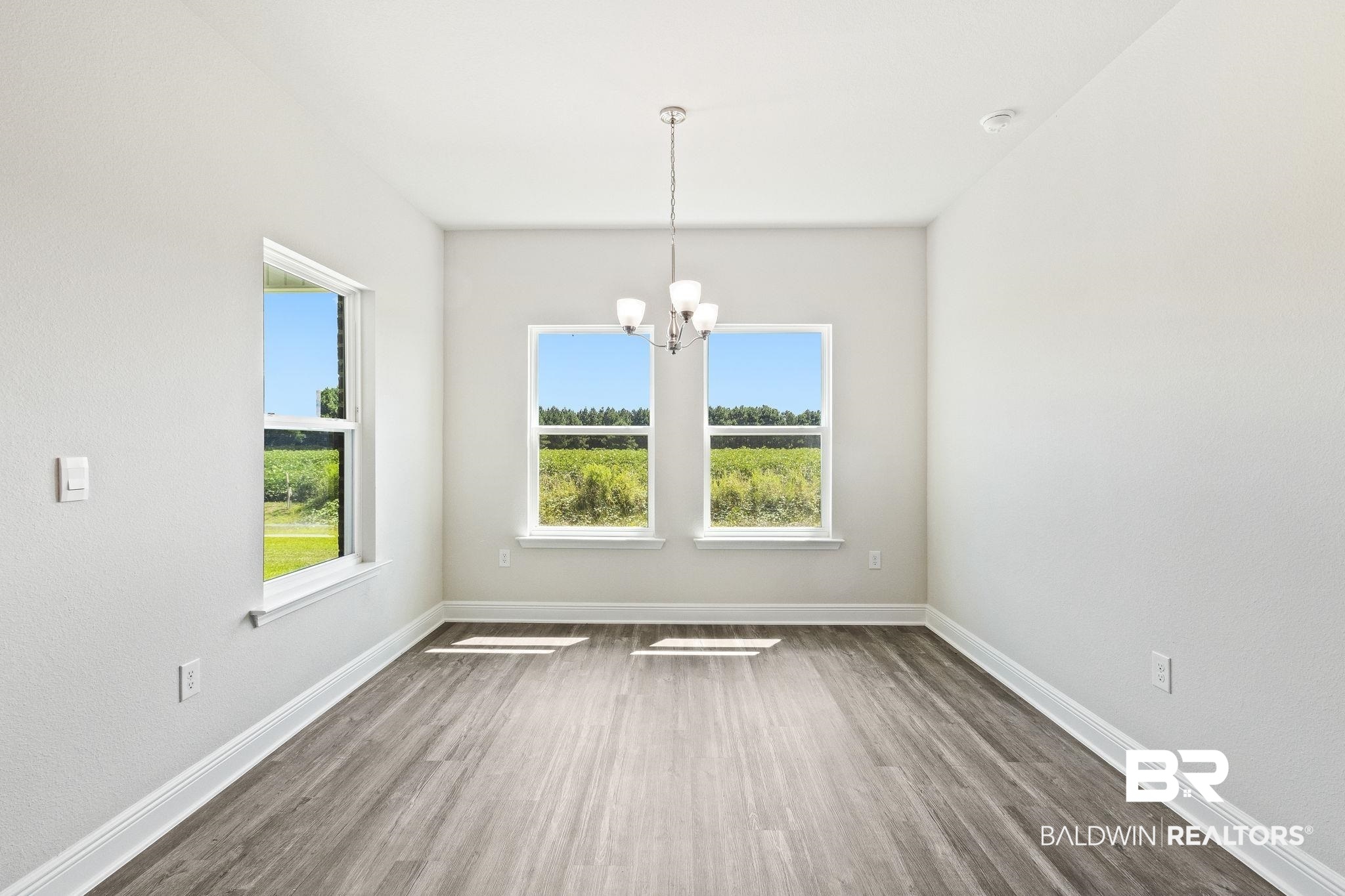 11303 Genuine Risk Circle Daphne, AL 36526 - Photo 28 of 100 Eating area in kitchen overlooking farmland.