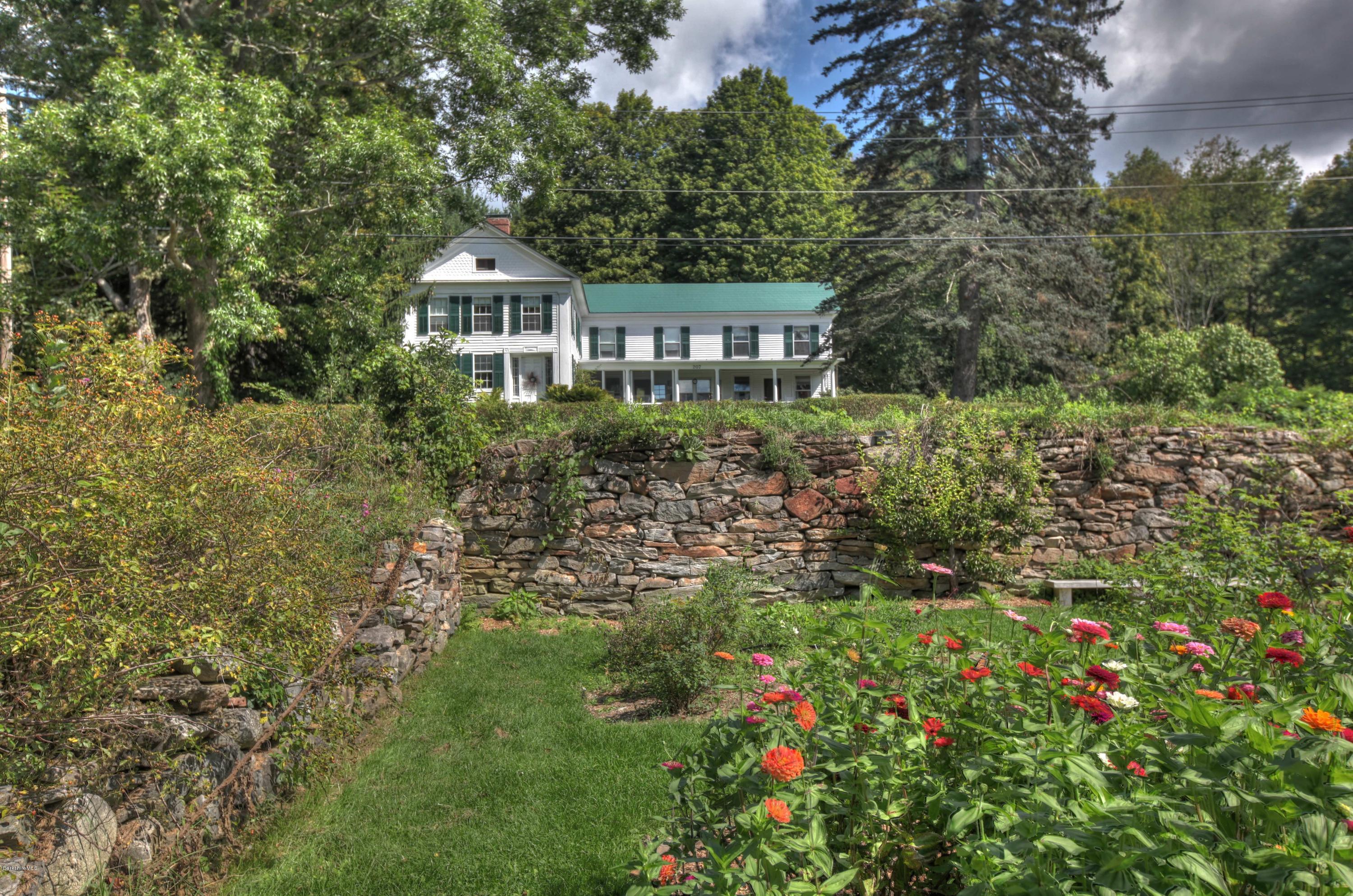 207 Main Road Tyringham, MA 01264 - Photo 12 of 71 a front view of a house with a garden