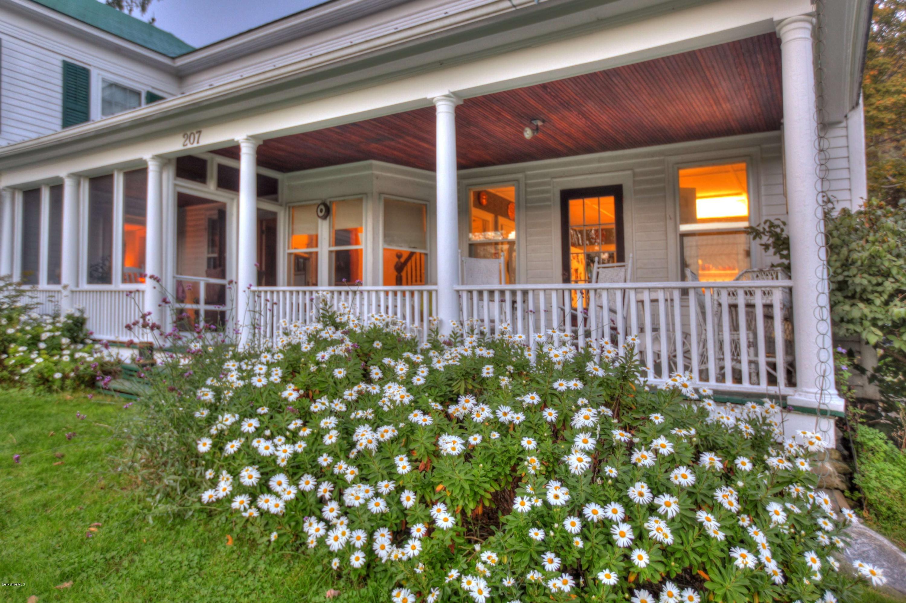 207 Main Road Tyringham, MA 01264 - Photo 16 of 71 a view of a house with a flower garden
