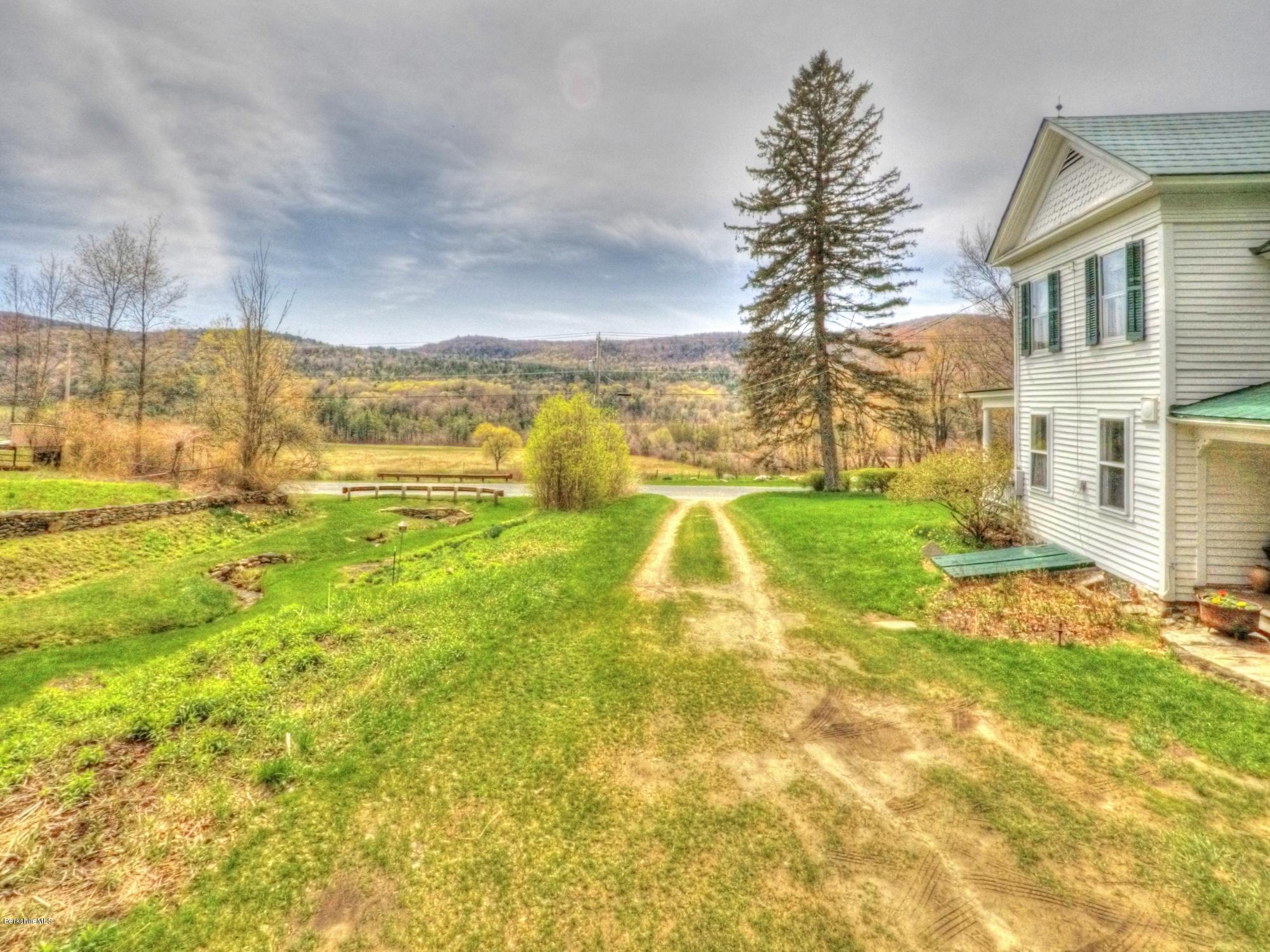 207 Main Road Tyringham, MA 01264 - Photo 20 of 71 a view of an ocean with a house