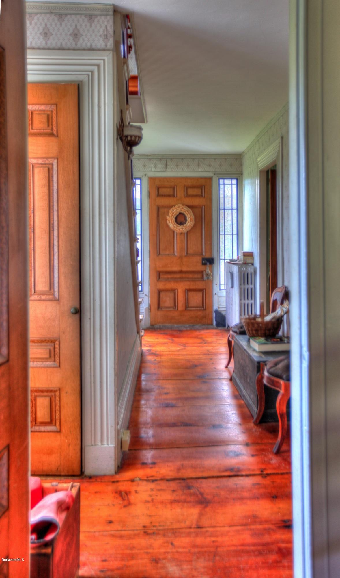 207 Main Road Tyringham, MA 01264 - Photo 22 of 71 a view of a livingroom with wooden floor and furniture