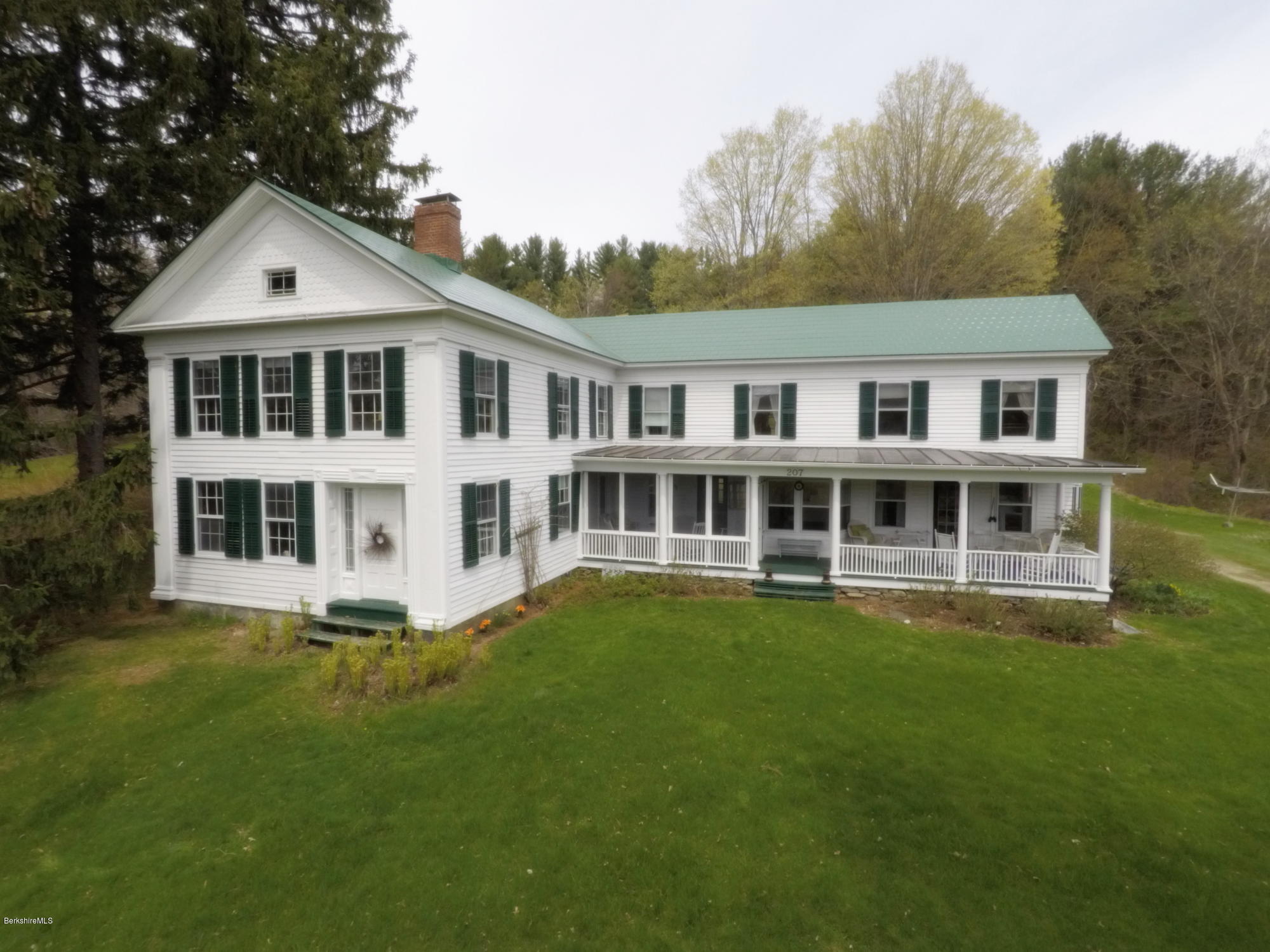 207 Main Road Tyringham, MA 01264 - Photo 27 of 71 a front view of a house with a garden