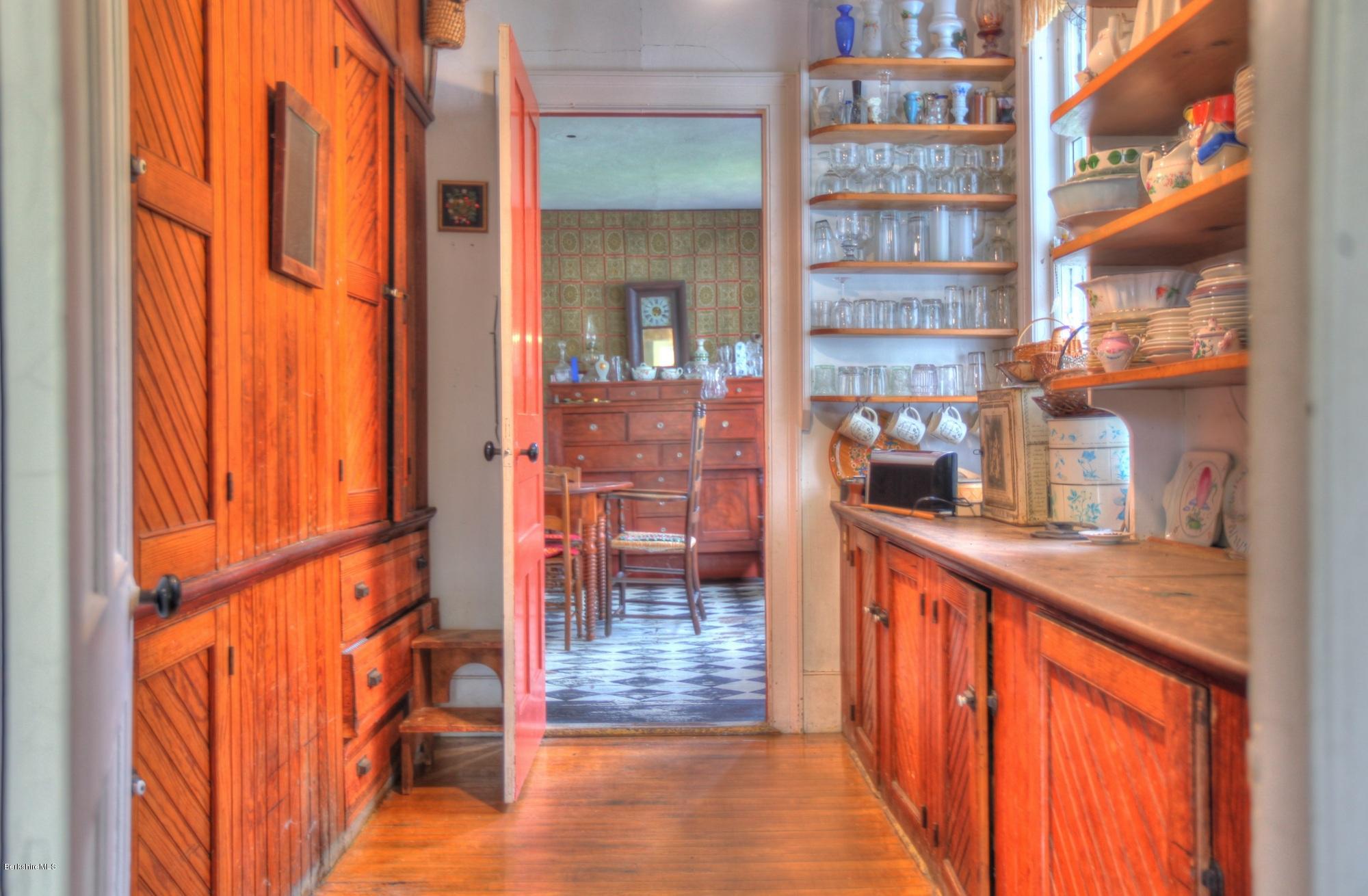 207 Main Road Tyringham, MA 01264 - Photo 30 of 71 a hallway with a large window in front of the house