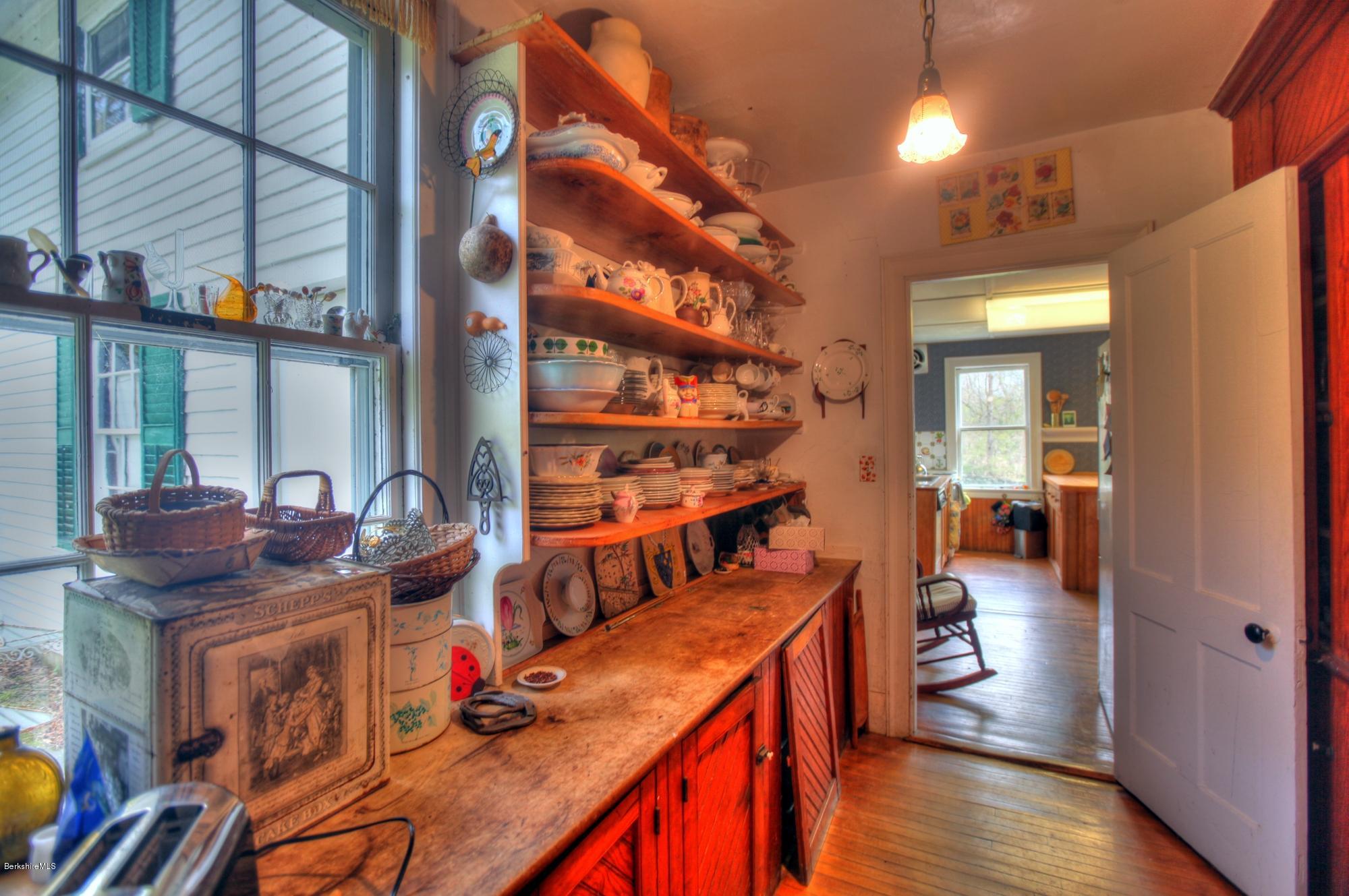 207 Main Road Tyringham, MA 01264 - Photo 43 of 71 a view of a dining room with furniture window and wooden floor