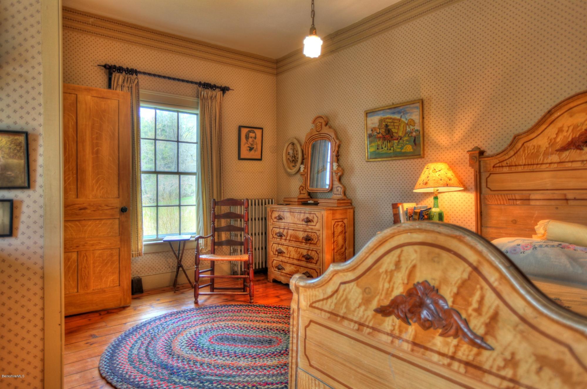 207 Main Road Tyringham, MA 01264 - Photo 55 of 71 a living room with furniture and a fireplace