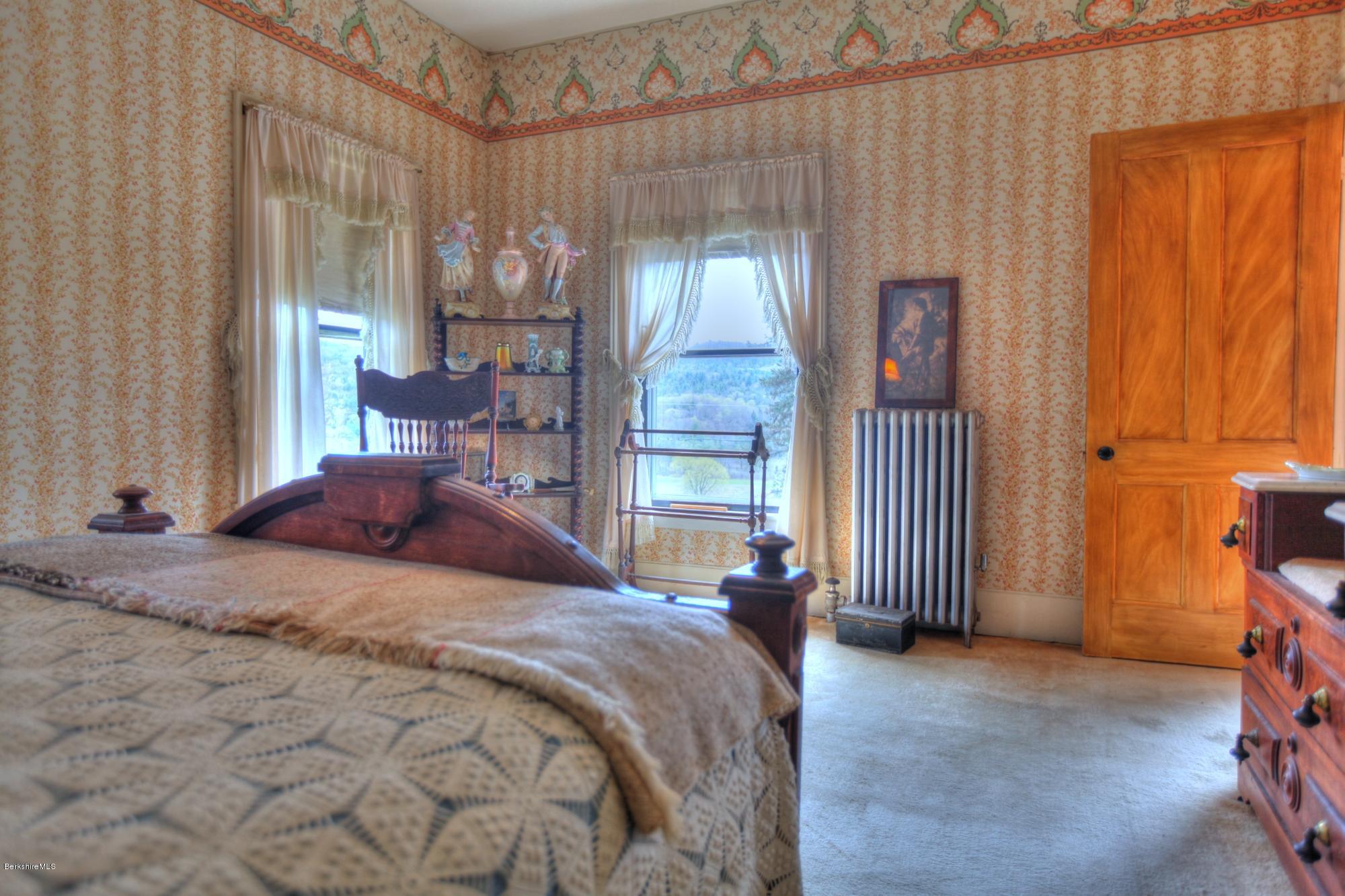 207 Main Road Tyringham, MA 01264 - Photo 61 of 71 a bedroom with a bed and a window
