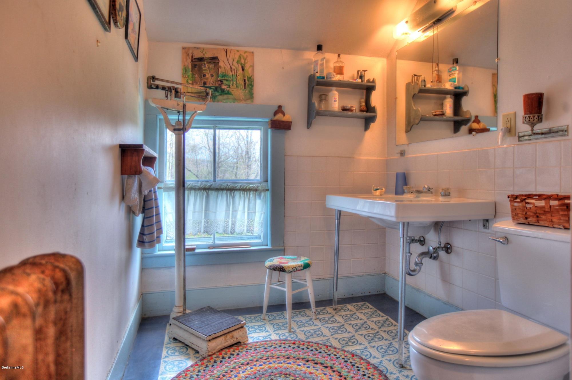 207 Main Road Tyringham, MA 01264 - Photo 64 of 71 a bathroom with a sink a toilet and shower