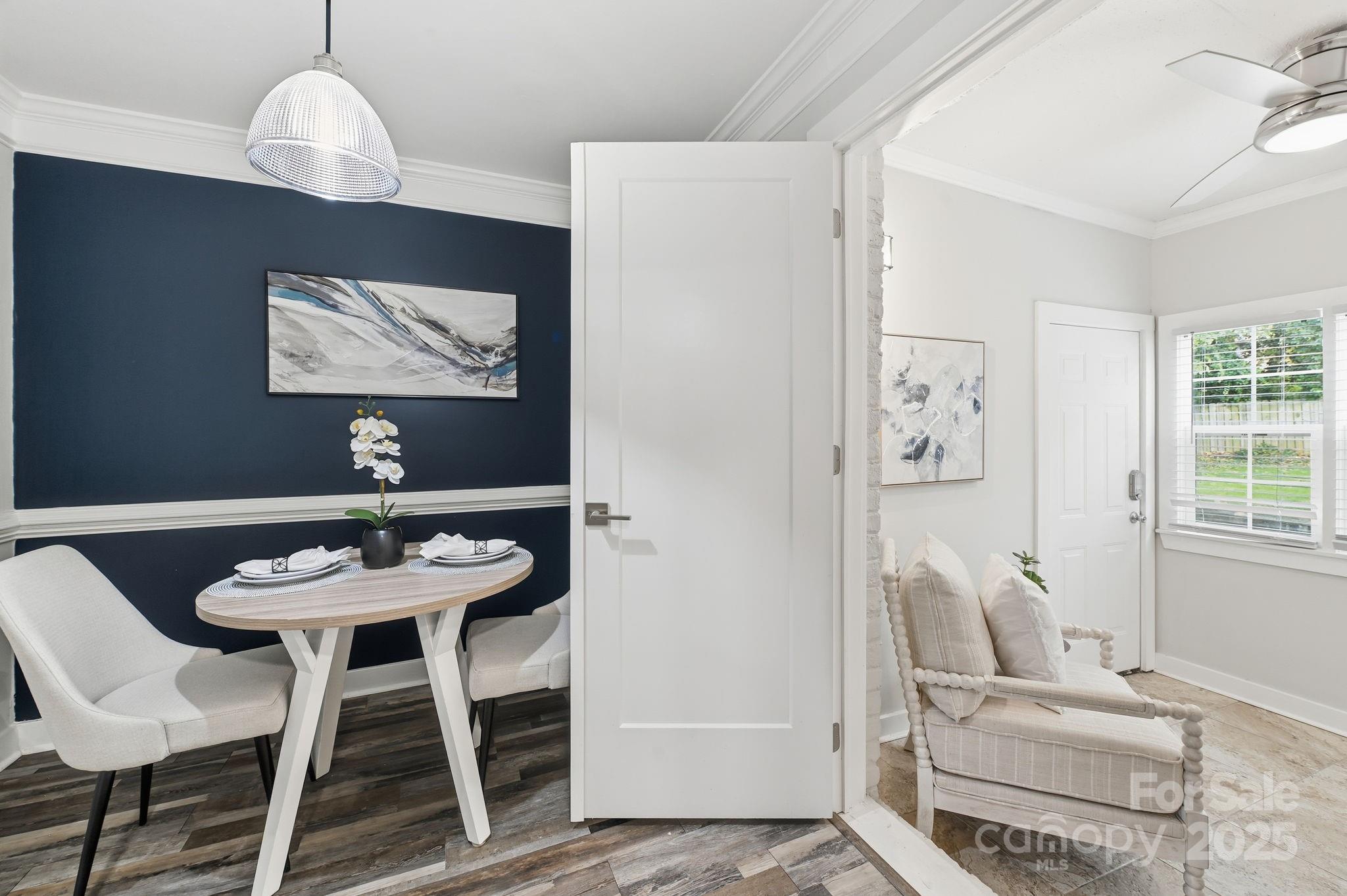 912 McAlway Road, Unit A Charlotte, NC 28211 - Photo 14 of 33 a view of a dining room with furniture and wooden floor
