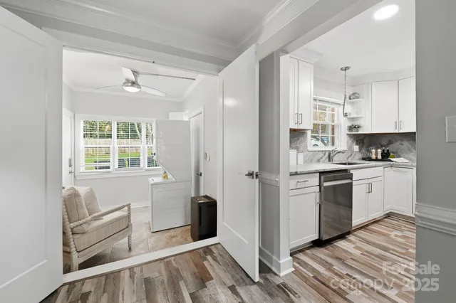 a kitchen with white cabinets and white appliances