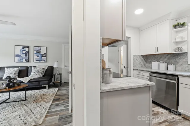 a kitchen with stainless steel appliances granite countertop a sink and stove