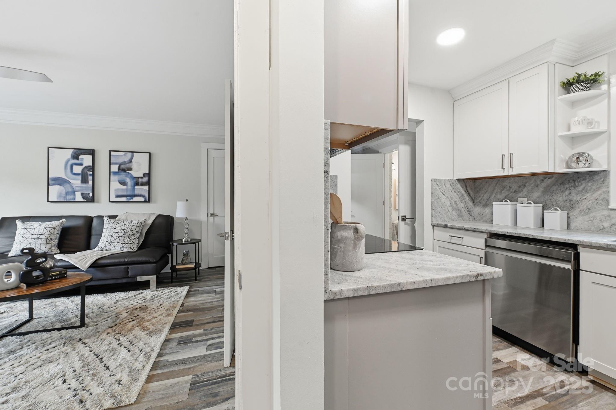 912 McAlway Road, Unit A Charlotte, NC 28211 - Photo 24 of 33 a kitchen with stainless steel appliances granite countertop a sink and stove