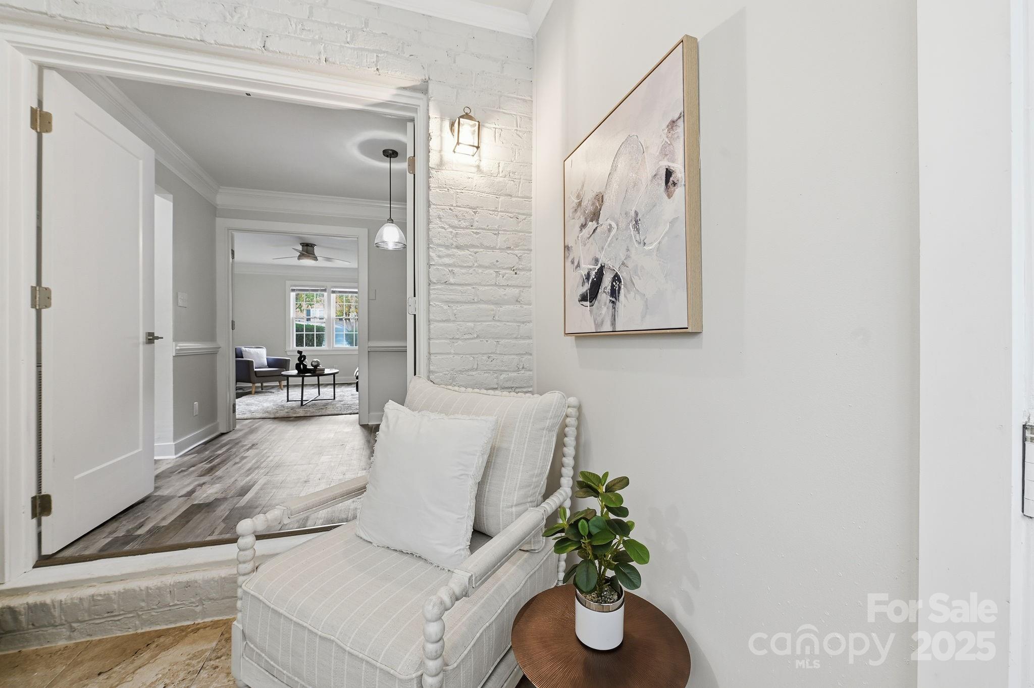 912 McAlway Road, Unit A Charlotte, NC 28211 - Photo 25 of 33 a living room with furniture and a potted plant