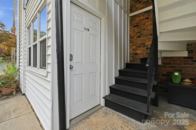 a view of a entryway door front of a house