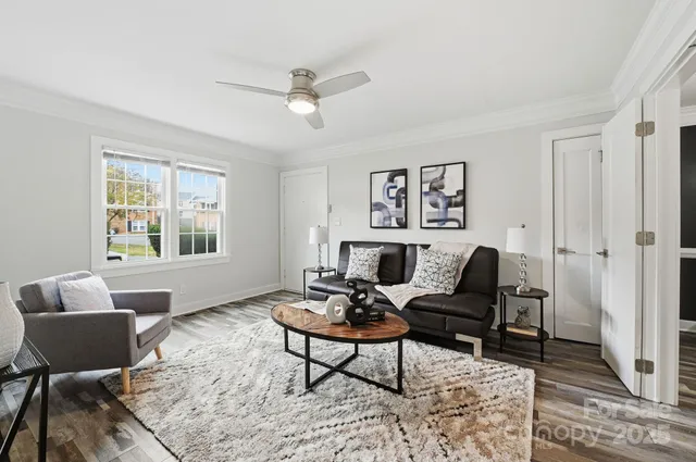 a living room with furniture and a window