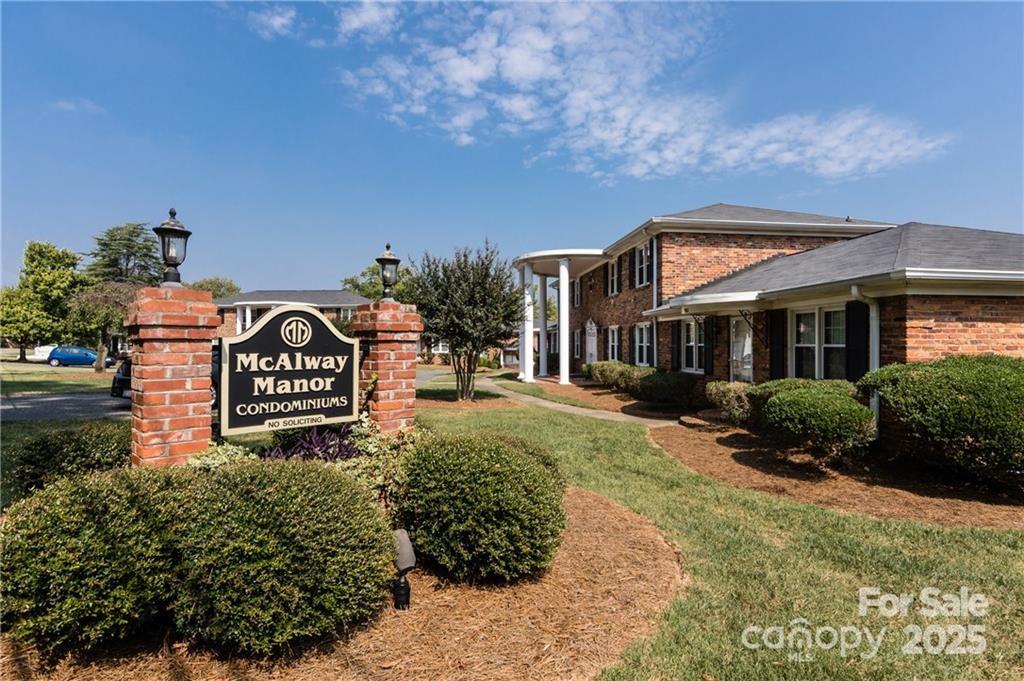 912 McAlway Road, Unit A Charlotte, NC 28211 - Photo 33 of 33 a front view of a house with a yard and outdoor seating