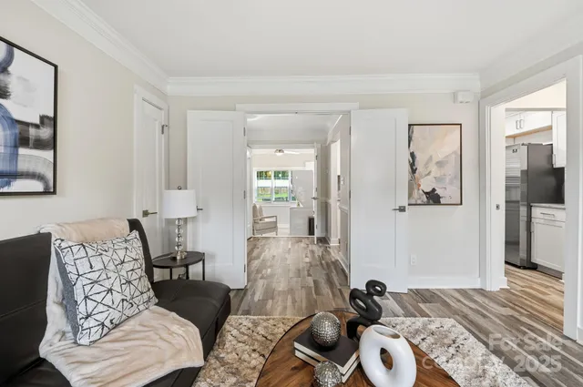 a bedroom with furniture and a wooden floor
