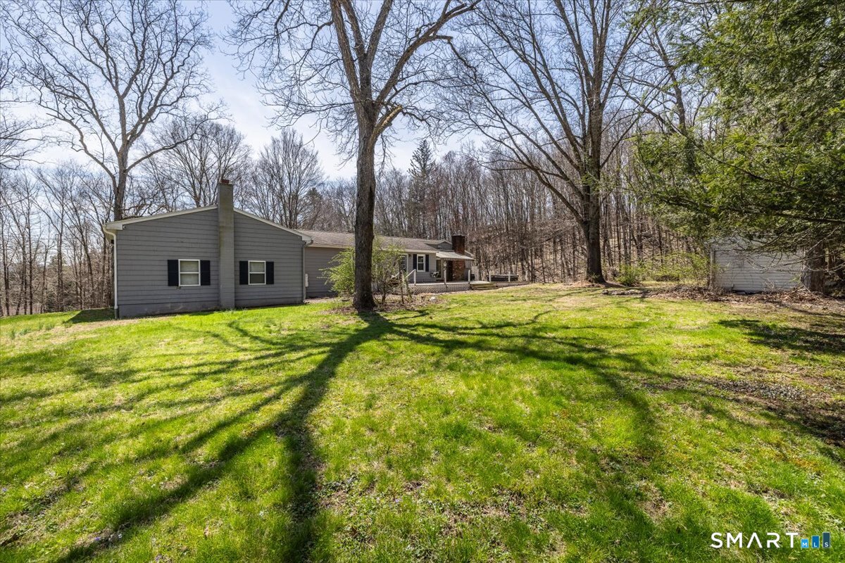 370 Quaker Farms Road Southbury, CT 06488 - Photo 32 of 35 a view of a house with a yard and tree