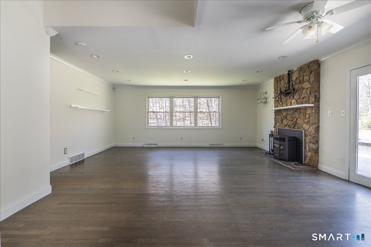 370 Quaker Farms Road Southbury, CT 06488 - Photo 4 of 35 wooden floor in an empty room with a window